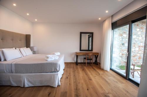 Posteľ alebo postele v izbe v ubytovaní Villa Gina by Elounda Island View Villas