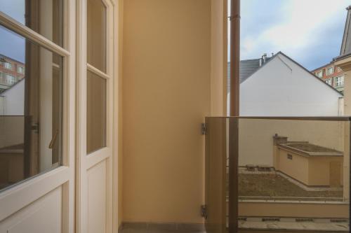 an open window with a view of a building at Unesco Prague Apartments in Prague