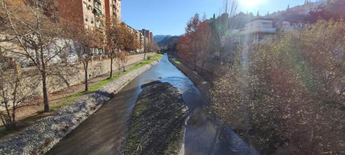 a view of a river from a bridge at La casita del río 2 in Granada