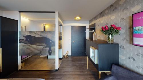 Postel nebo postele na pokoji v ubytování Hotel Panther'A