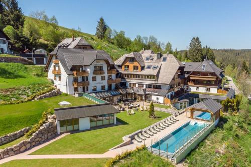 an aerial view of a large house with a swimming pool at Hotel Schlehdorn in Feldberg