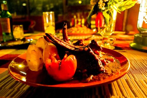a red plate of food on a table at Maili Saba Camp in Nakuru