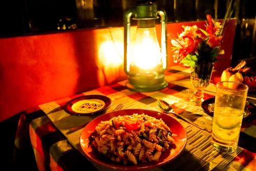 a table with a plate of food on a table at Maili Saba Camp in Nakuru