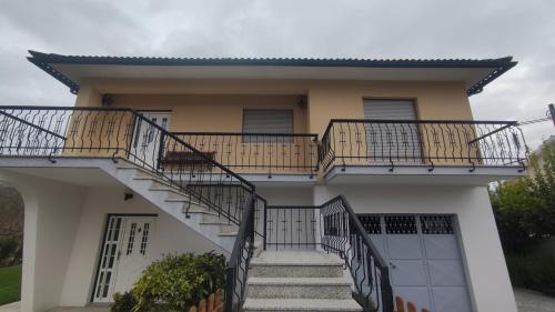 a house with stairs in front of it at Casa da Bia - AL em Arcos de Valdevez in Arcos de Valdevez