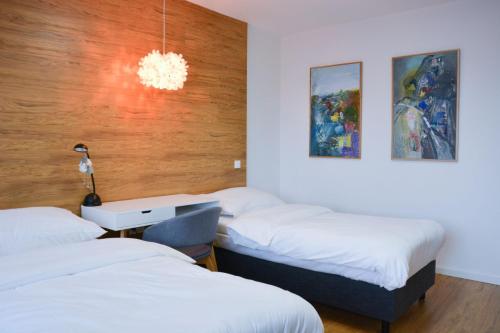 En eller flere senge i et værelse på Luxury apartment with private sauna Pod Javorovým