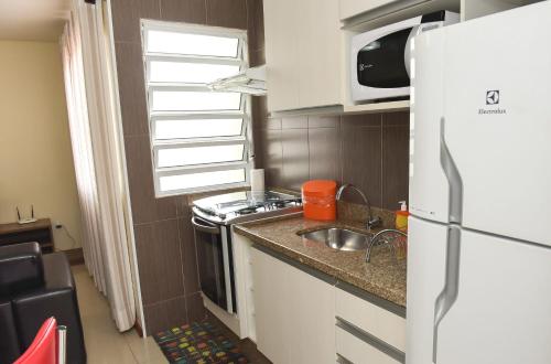 
A cozinha ou cozinha compacta de Residencial Flat Villa Rosa
