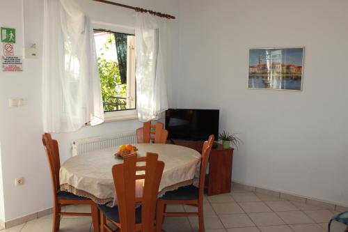 TV a/nebo společenská místnost v ubytování Pile Apartments 6