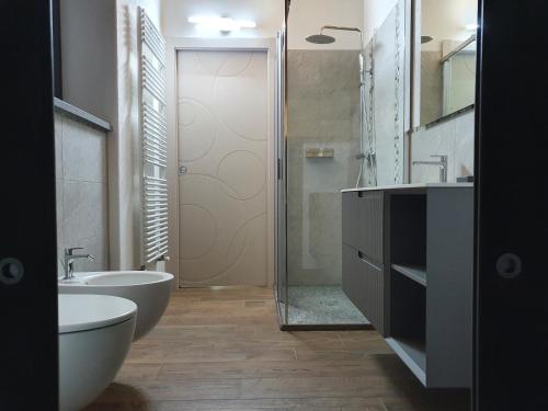 a bathroom with a tub and a toilet and a sink at Casa Vacanza Lo Nânò in Fenis