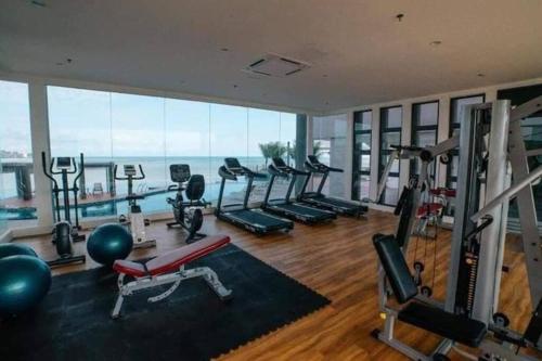a gym with a lot of treadmills and exercise equipment at Serene Studio Imperium Residence Kuantan in Kuantan