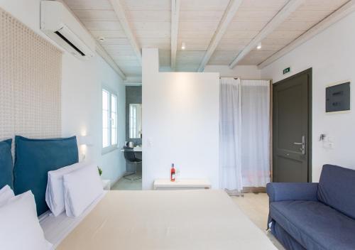 a living room with a couch and a table at Princess Of Naxos in Naxos Chora