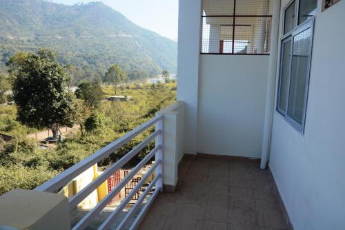 Балкон или тераса в Shivalik Riverine Homestay and hotel