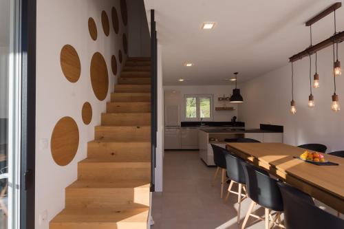 a staircase leading to the kitchen and dining room of a house at The Valley Queens in Bovec