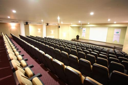 an empty lecture hall with chairs and a screen at Monte Baia Uludağ - Full Board Plus in Uludag