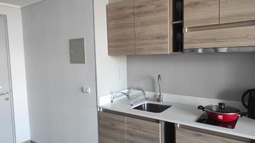 Apart Hotel Bauerle & Apartamentosにあるキッチンまたは簡易キッチン