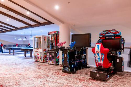 a room with a bunch of video games and a pool table at Monte Baia Uludağ - Full Board Plus in Uludag