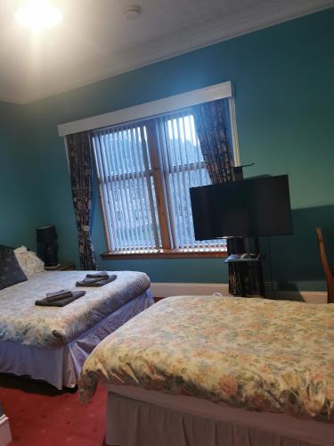 Katil atau katil-katil dalam bilik di Park Guest House