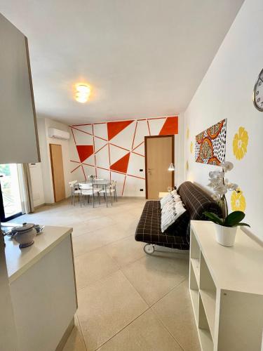 a living room with a couch and a table at Casa Vacanze Serra in Porto Palo