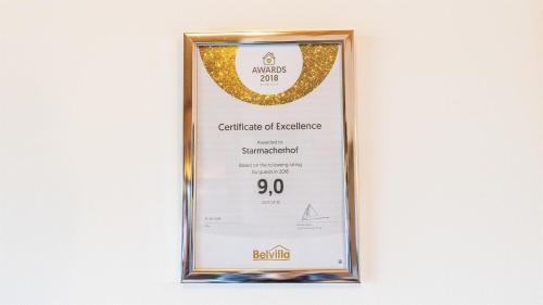 a framed diploma frame with a certificate of excellence award at Starmacher Hof in Itter