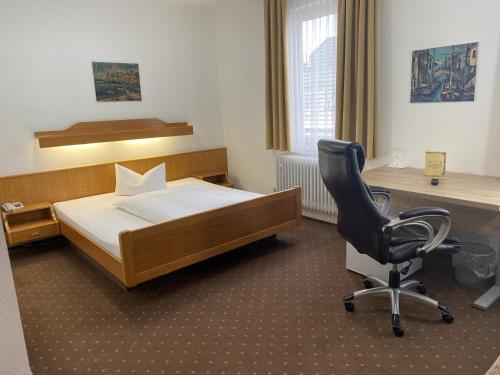 Ένα ή περισσότερα κρεβάτια σε δωμάτιο στο Hotel Rosengarten Tuttlingen