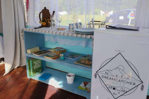 a table in a play room with a table with a table at Combi Bus Dreamcatcher in Sarchí