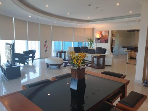 a living room with a pool table and a piano at Costa Del Sol Hotel by Arabian Link in Kuwait
