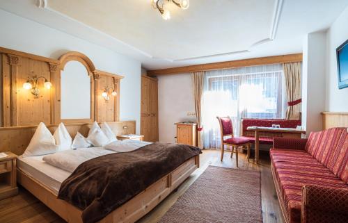 Postel nebo postele na pokoji v ubytování Garni Hotel Rosengarten B&B