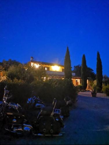 a building with a bunch of bikes parked in front of it at Casale Terre Rosse in Saturnia