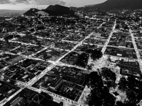 a black and white photo of a city with buildings at Suites de La Parra in Oaxaca City