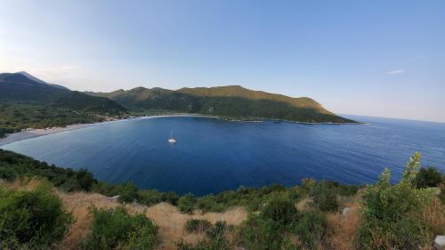 an island in the middle of a large body of water at Amygdalia, a Stone House in a quiet landscape in Leonidion