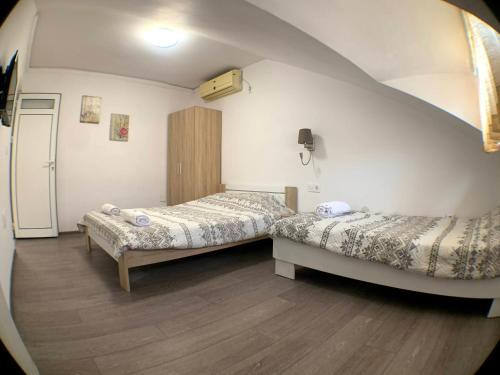 Ένα ή περισσότερα κρεβάτια σε δωμάτιο στο Samuil Apartments - Central Burgas