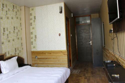 Tempat tidur dalam kamar di Hotel Sapphire