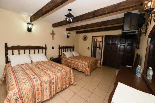 Giường trong phòng chung tại Hotel Y Villas Vanessa