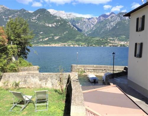 a house with a view of a lake and mountains at Domus Graziana in Oliveto Lario