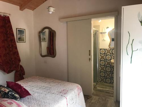 Postel nebo postele na pokoji v ubytování Suosogno sul mare 200metri dalla spiaggia