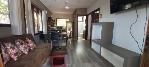 a living room with a couch and a table at Massai Apartments in Playa Flamingo