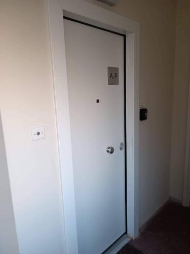a door in a room with an ar sign on it at A.P Seaside in Artemida