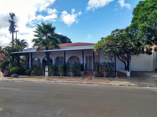 a house on the side of the street at Pousada Rosa de Saron in Holambra