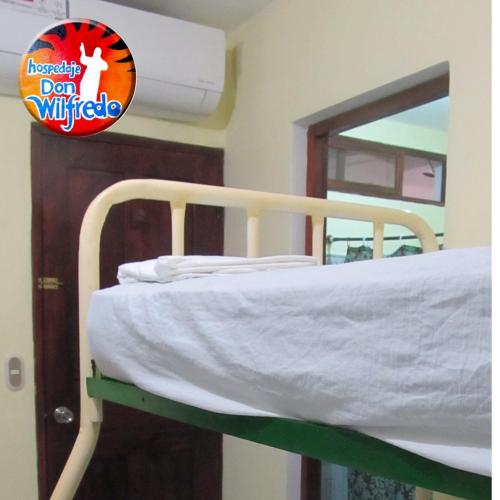 a bunk bed in a room with a mirror at AC Room 4 Persons Hospedaje Don Wilfredo in San Juan del Sur