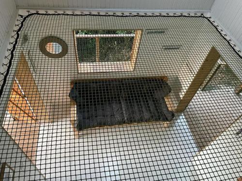 an overhead view of a bird cage with a window at AYOUNAKA in Bouillante