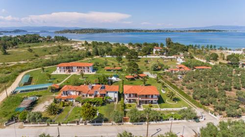 an aerial view of a house with a lake at Studios Anna in Vourvourou