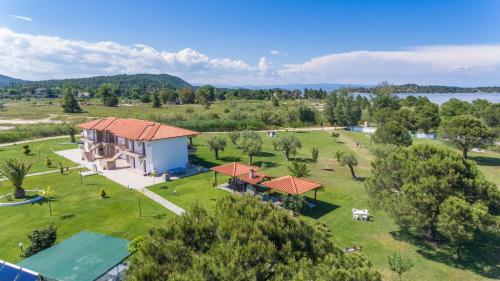 an aerial view of a house with a park at Studios Anna in Vourvourou