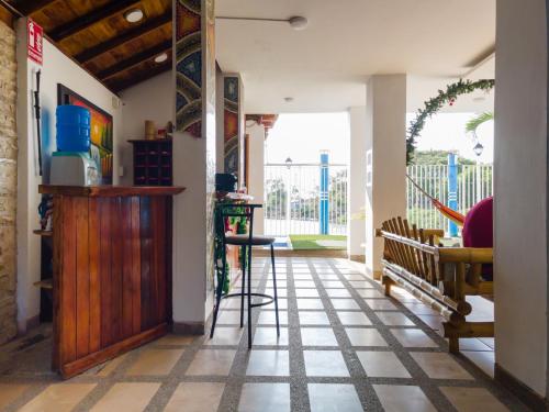 a hallway with a table and a bar in a house at Hotel Sol y Playa Montañita in Montañita