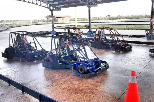 a group of three tractors parked in a building at El más completo, a menos de 5 minutos de la playa, free wifi fuera del alojamiento in San Felipe de Puerto Plata