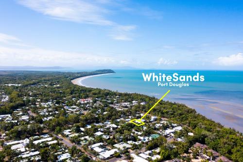 an aerial view of white sands resort dixon with the beach and ocean at WhiteSands in Port Douglas