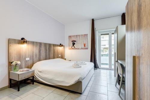 Tempat tidur dalam kamar di B&B Casa Der Poeta