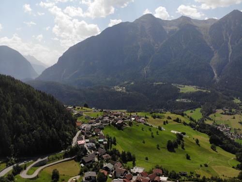 a small town in a valley in the mountains at Ferienhaus Jäger in Oetz