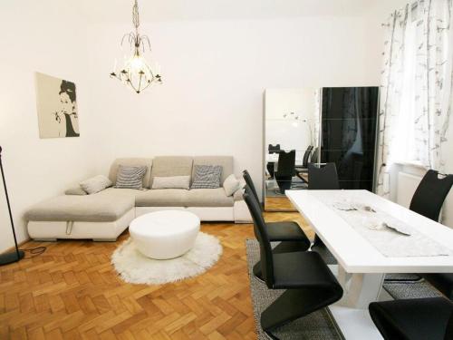 a living room with a couch and a table at Ferienwohnung Urban-Loritz in Vienna