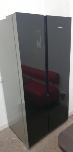 a glass cabinet with red seats in it at Hostel Capsule in Kyiv