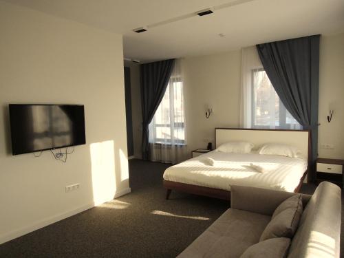 Un pat sau paturi într-o cameră la Hotel 78 Cafe