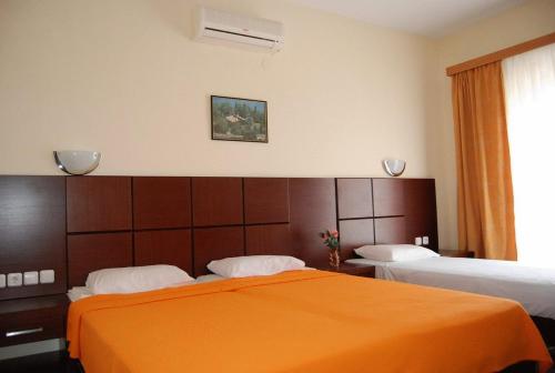 En eller flere senger på et rom på Hotel Dias Apartment